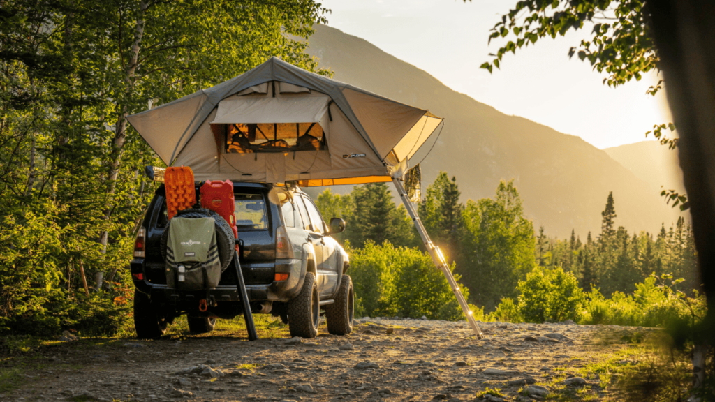car camping in a vehicle with a rooftop tent
